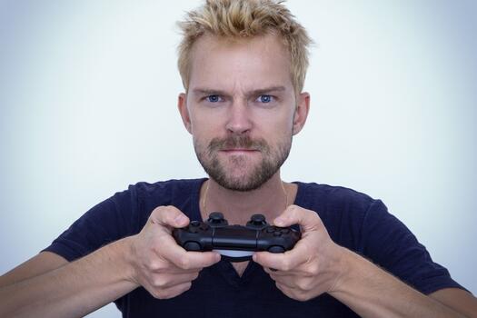 Mann spielt mit Playstation, Foto: Sam Williams auf Pixabay